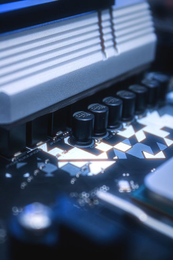Printed circuit board featuring axial-lead capacitors and conductive traces