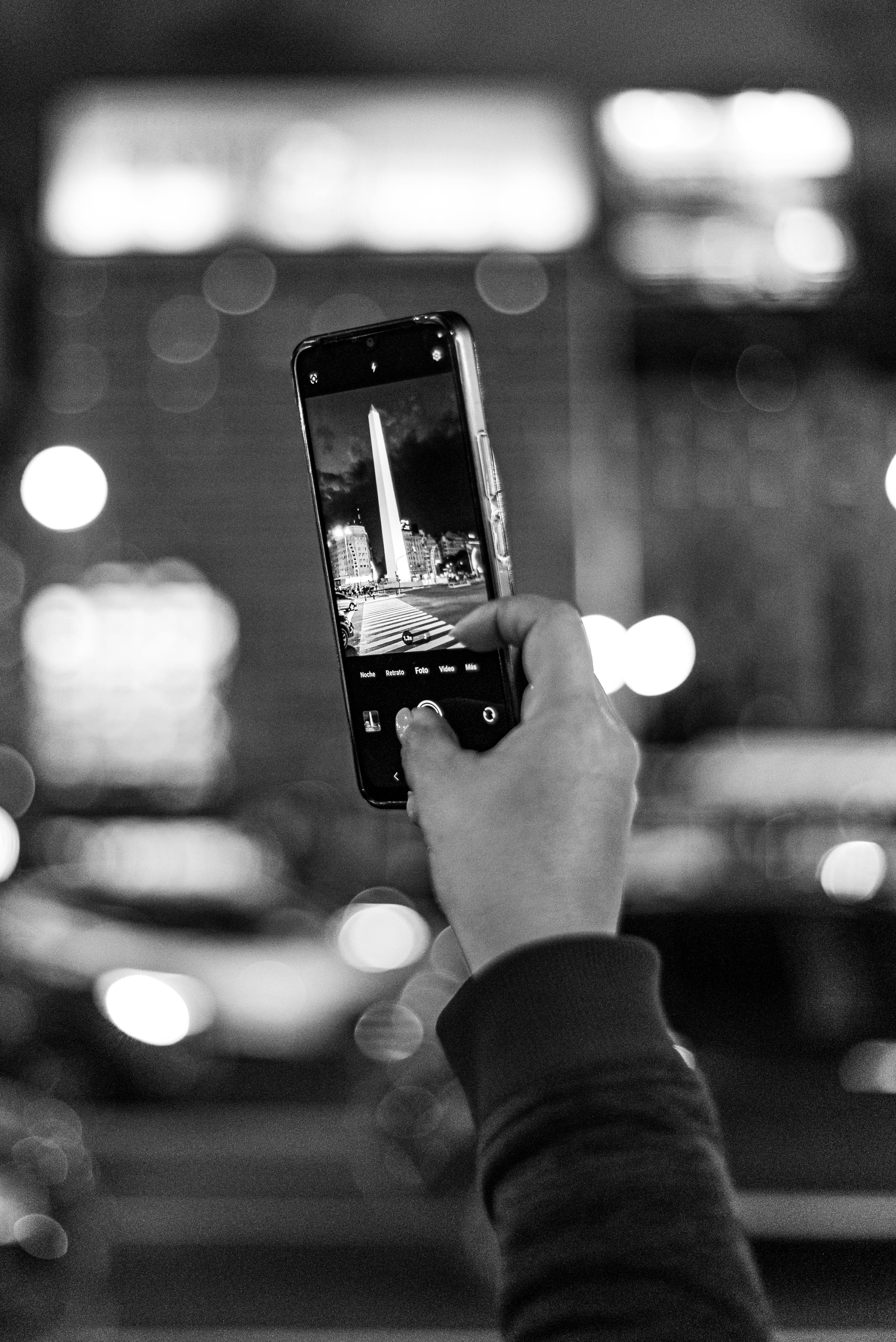 Free Black and white photo capturing the Obelisk in Buenos Aires through a smartphone camera. Stock Photo