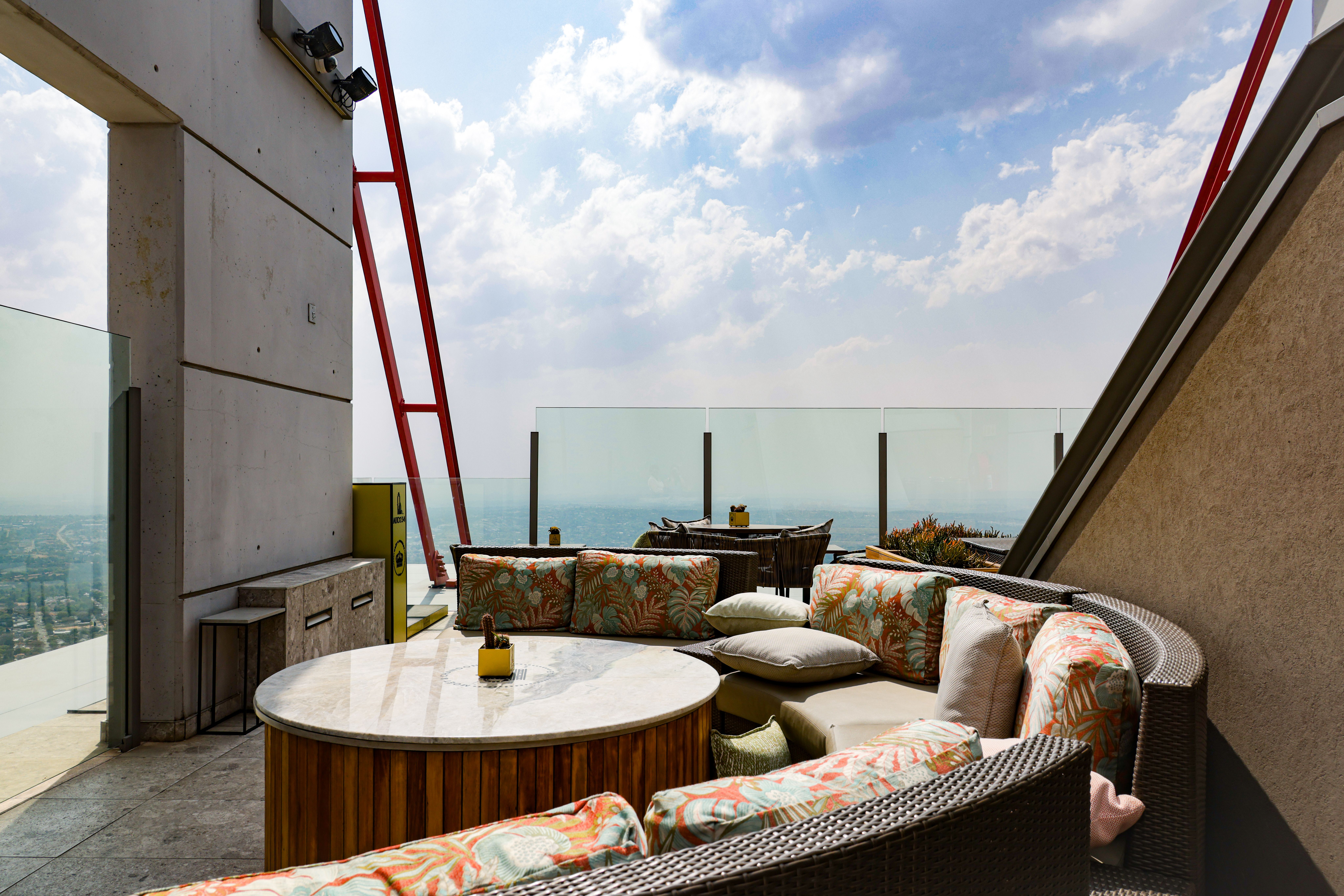 Curated visual reference: Visual Reference: Rooftop Lounge With Scenic City View