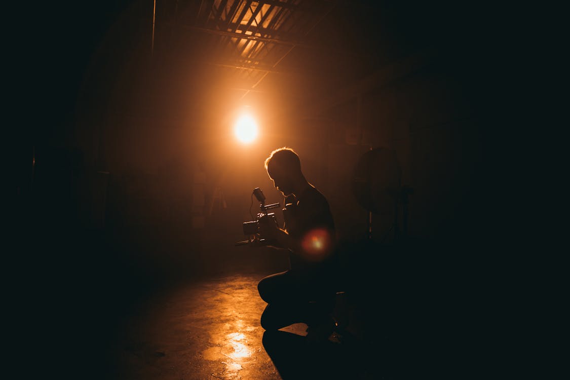 Free Man Playing Guitar on Stage Stock Photo