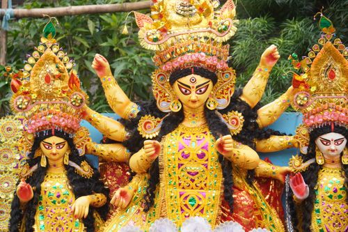 Free Vibrant and intricately designed Durga idols at a Kolkata festival, celebrating Durga Puja. Stock Photo