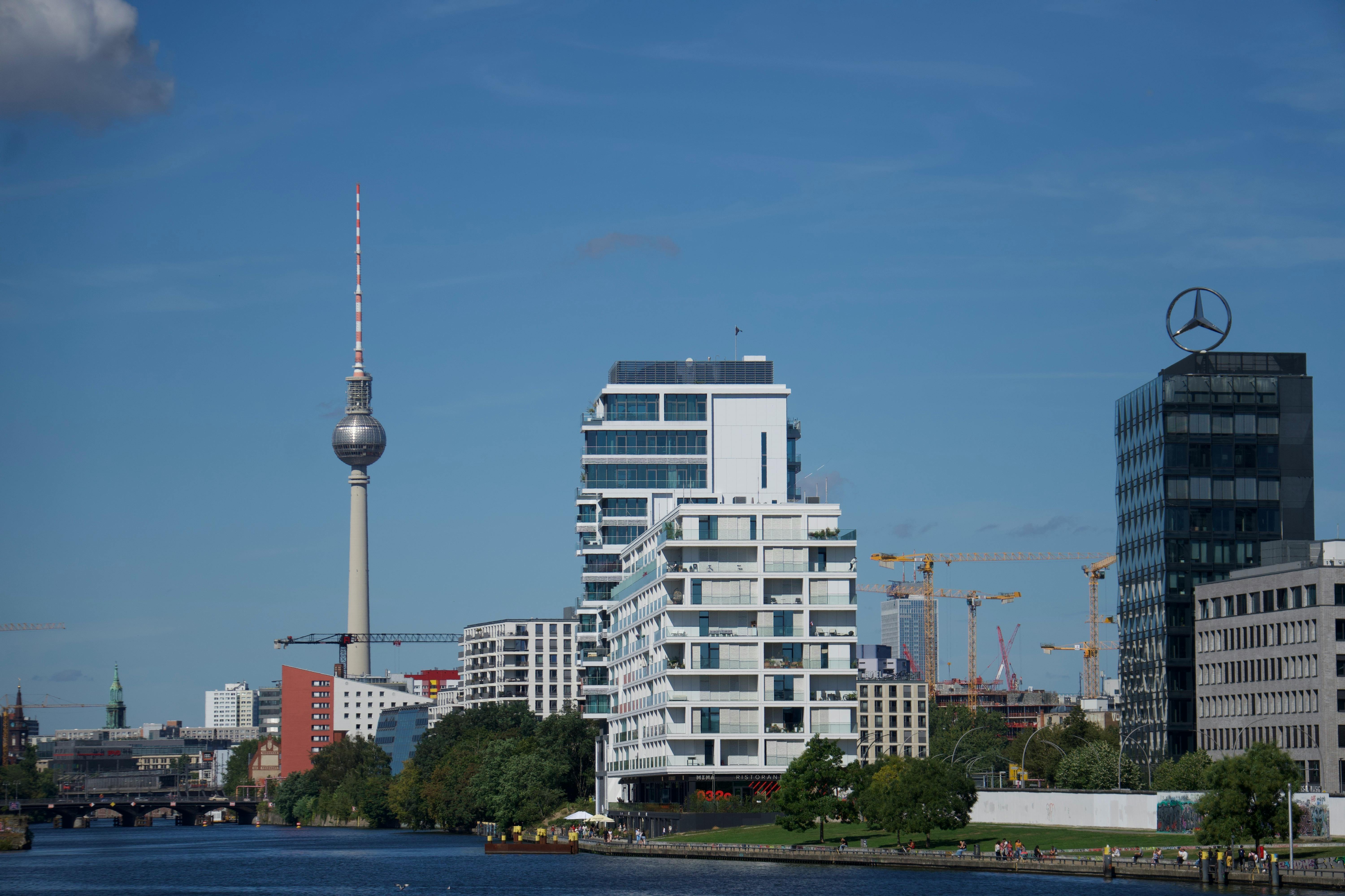 Scenic view of Berlin's skyline with the TV Tower and modern architecture under a clear blue sky.