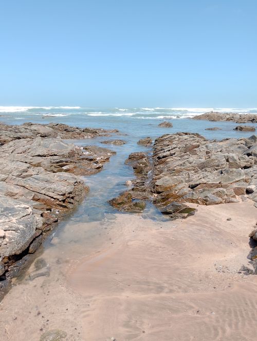 Free A serene ocean view with rocky formations on a beach in Casablanca, Morocco. Stock Photo