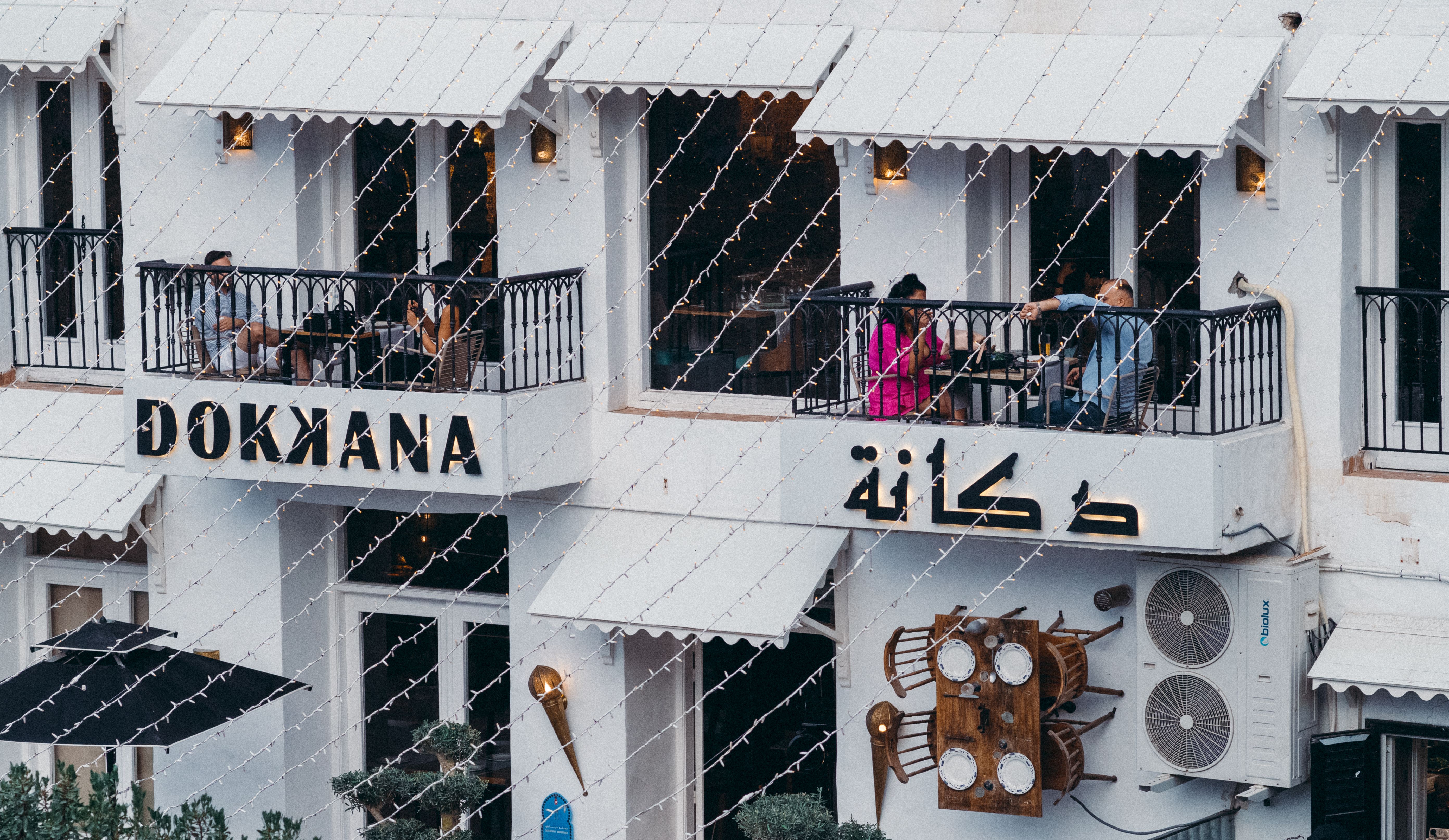 Elegant terrace view of Dokkana restaurant in La Marsa, Tunis with patrons enjoying a meal.