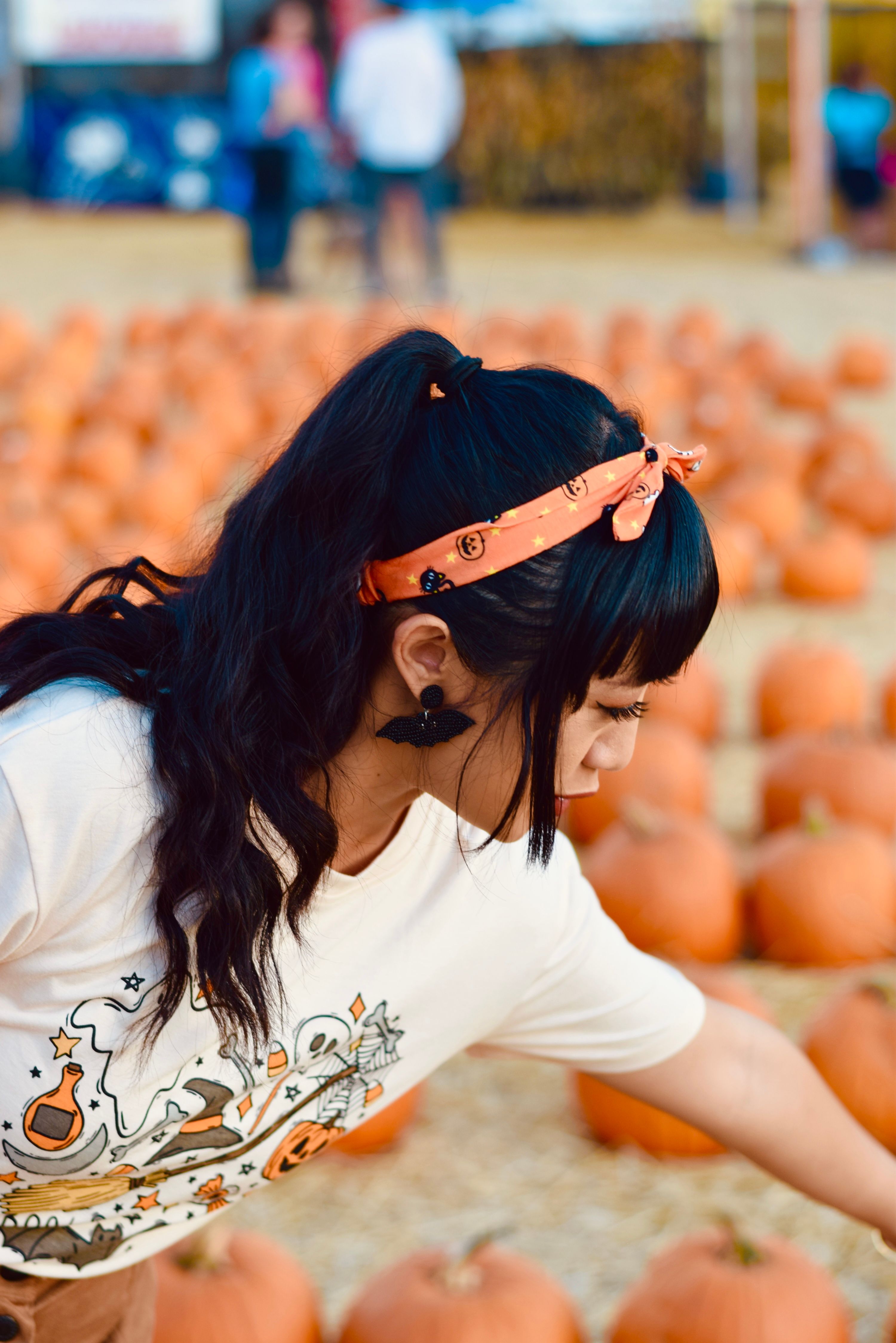 Little Girl Standing Next to Wheelbarrow Full of Pumpkins · Free Stock ...