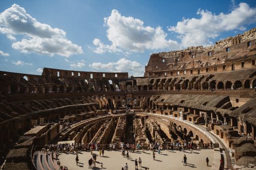 Free Explore the ancient majesty of the Colosseum in Rome, Italy, under a vibrant blue sky. Stock Photo