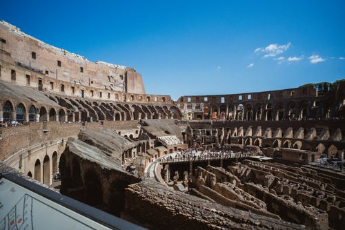 Free Explore the historic interior of the Colosseum in Rome, a symbol of ancient gladiator battles. Stock Photo