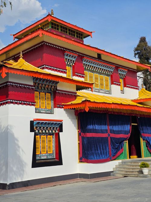 Free Vibrant exterior of a traditional monastery with intricate details under clear sky. Stock Photo
