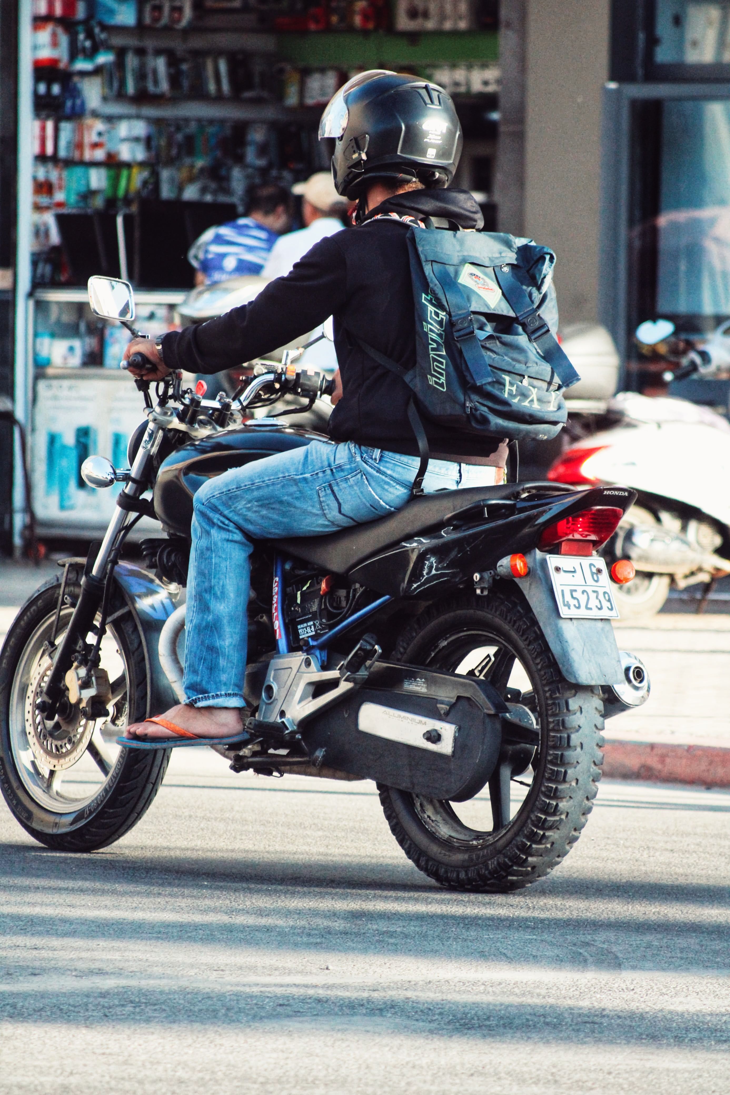 Casual Urban Motorcycle Ride in City Traffic · Free Stock Photo