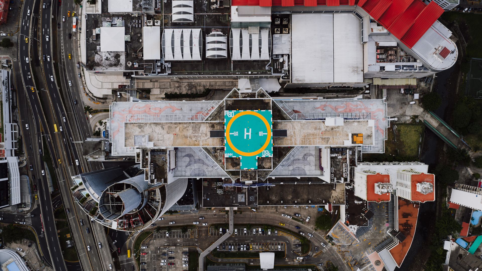 Aerial shot of urban architecture in Panama City with a prominent helipad.