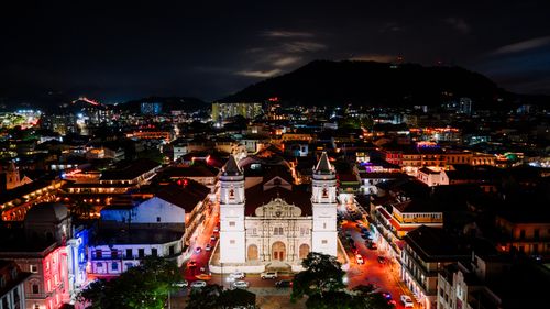 Free A captivating aerial view of Panama City's Casco Viejo at night, illuminated by vibrant city lights. Stock Photo