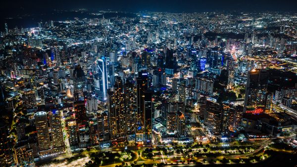 Aerial view of a city skyline at night — photo by K on Pexels