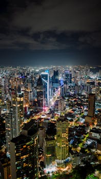 Stunning aerial view of Panama City illuminated at night, showcasing vibrant city lights.