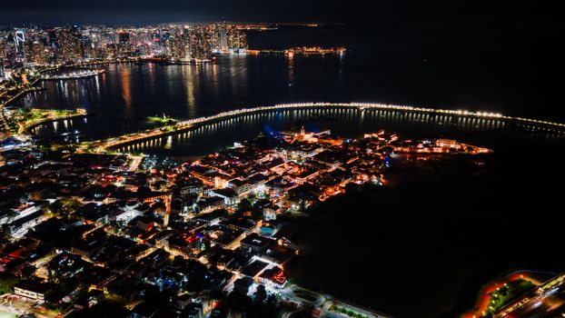 Stunning aerial view of Panama City at night showcasing its vibrant skyline and waterfront.