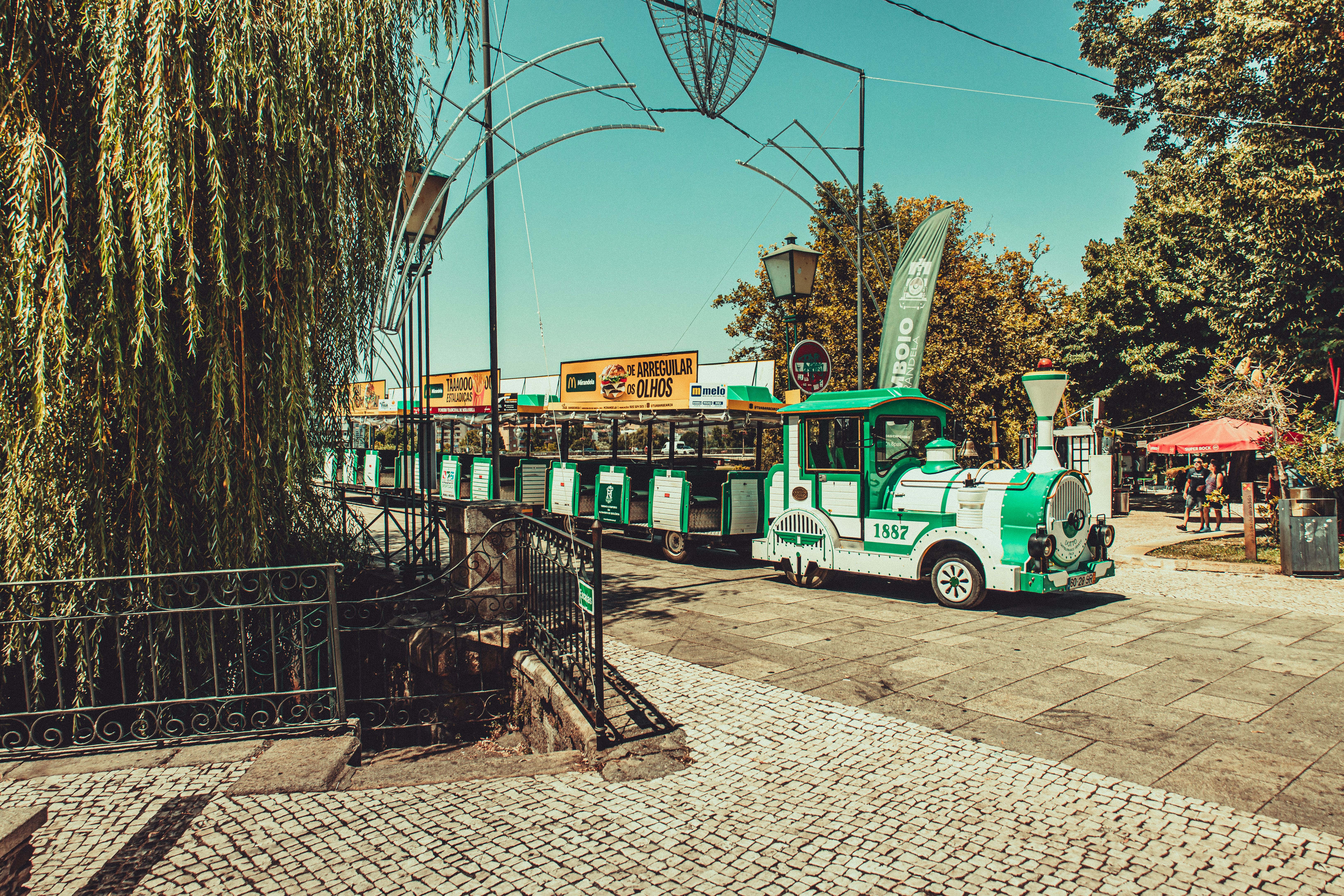Charming Street Train Ride in a Sunny Park Setting · Free Stock Photo