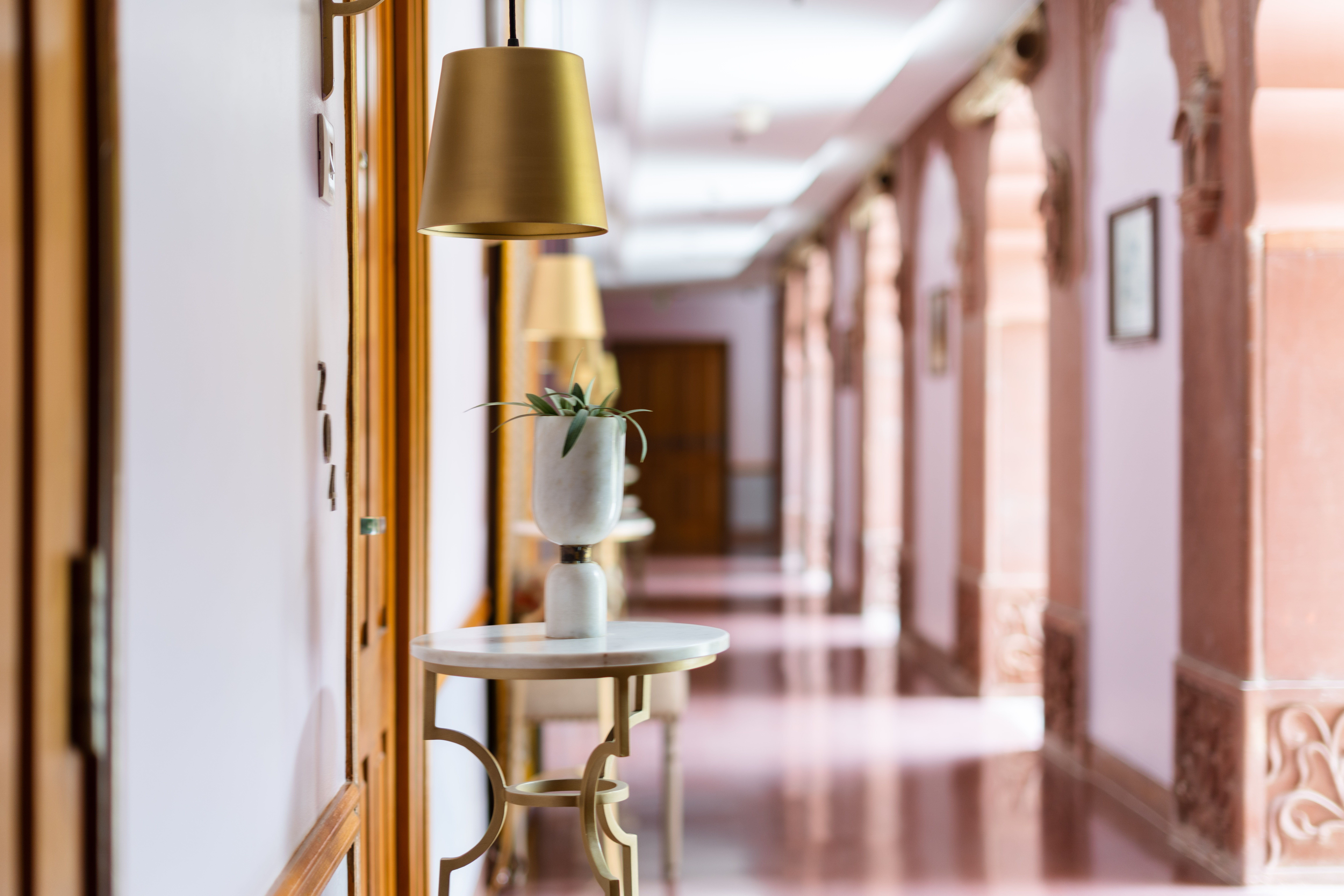 Hotel corridor with guest room doors along an internal path of travel