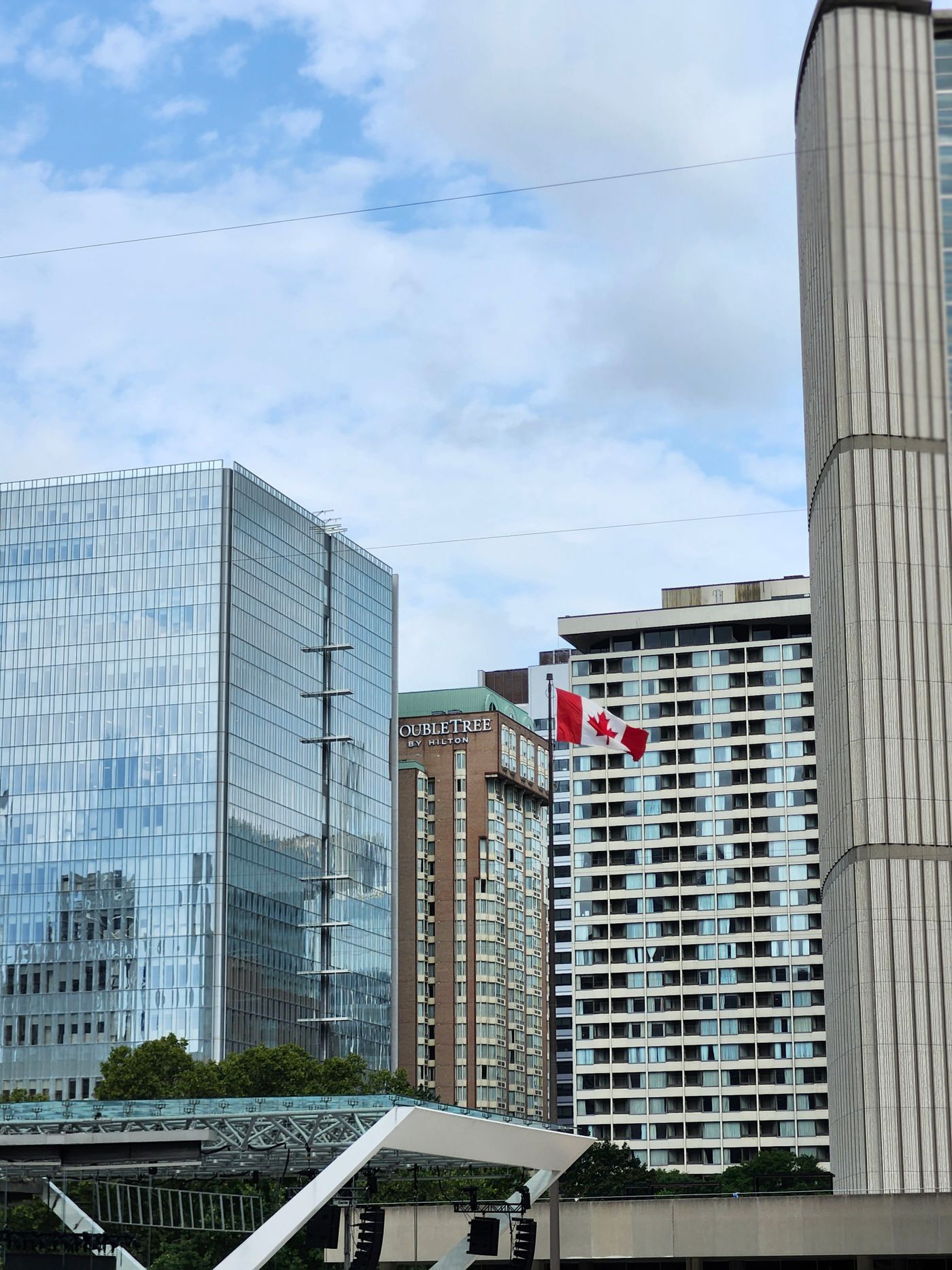 Toronto skyline with the Canadian flag, representing the Express Entry pathway Chandigarh students are pursuing through French language skills