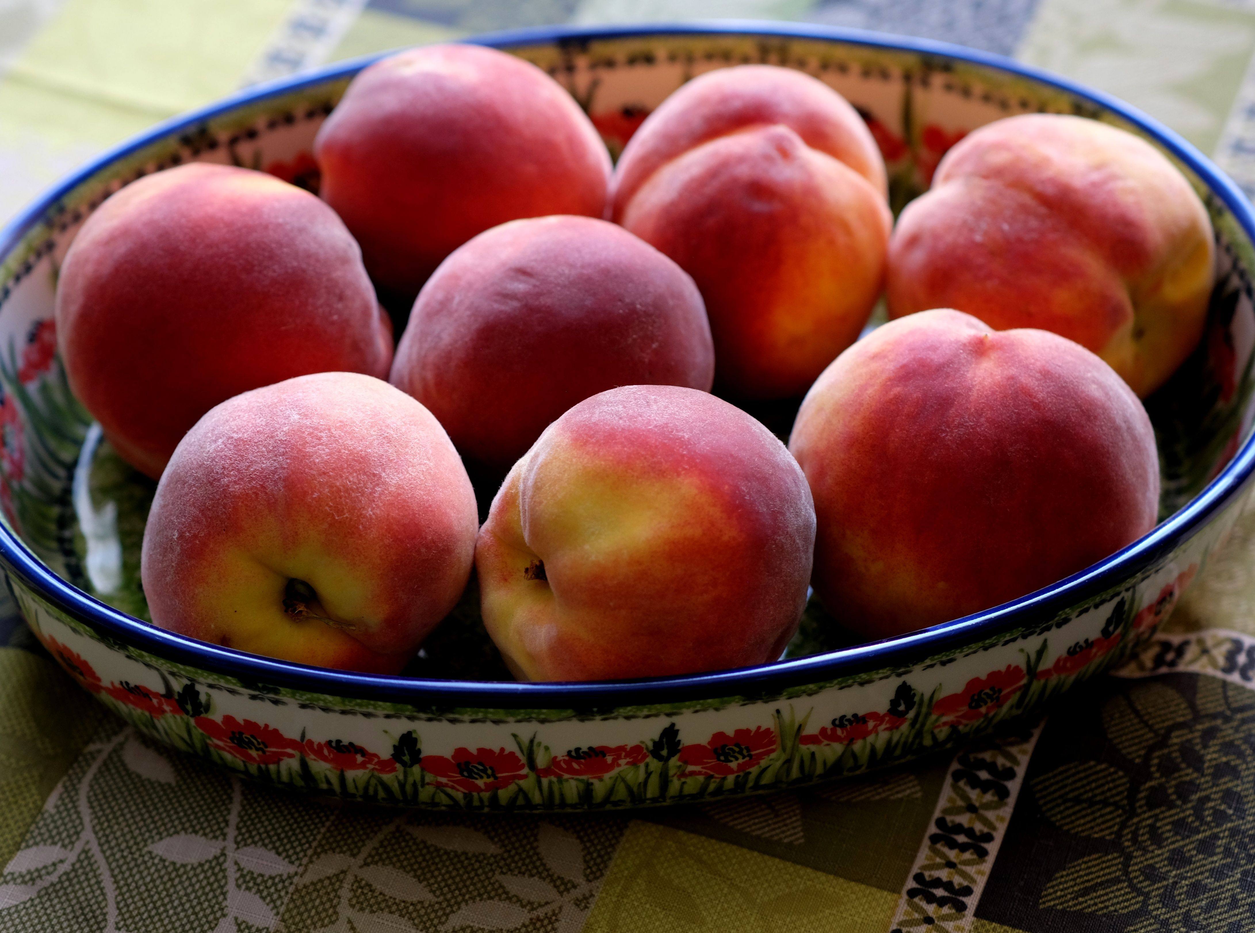 Fresh Ripe Peaches in a Floral Ceramic Dish · Free Stock Photo