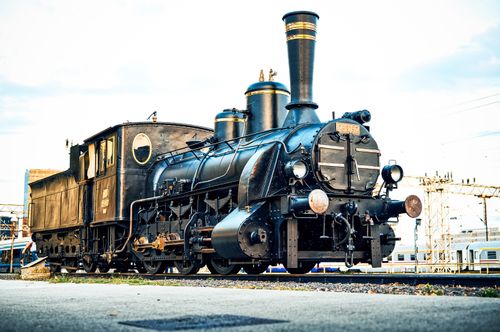 Free Classic steam locomotive captured in a vintage style at a train station during daytime. Stock Photo