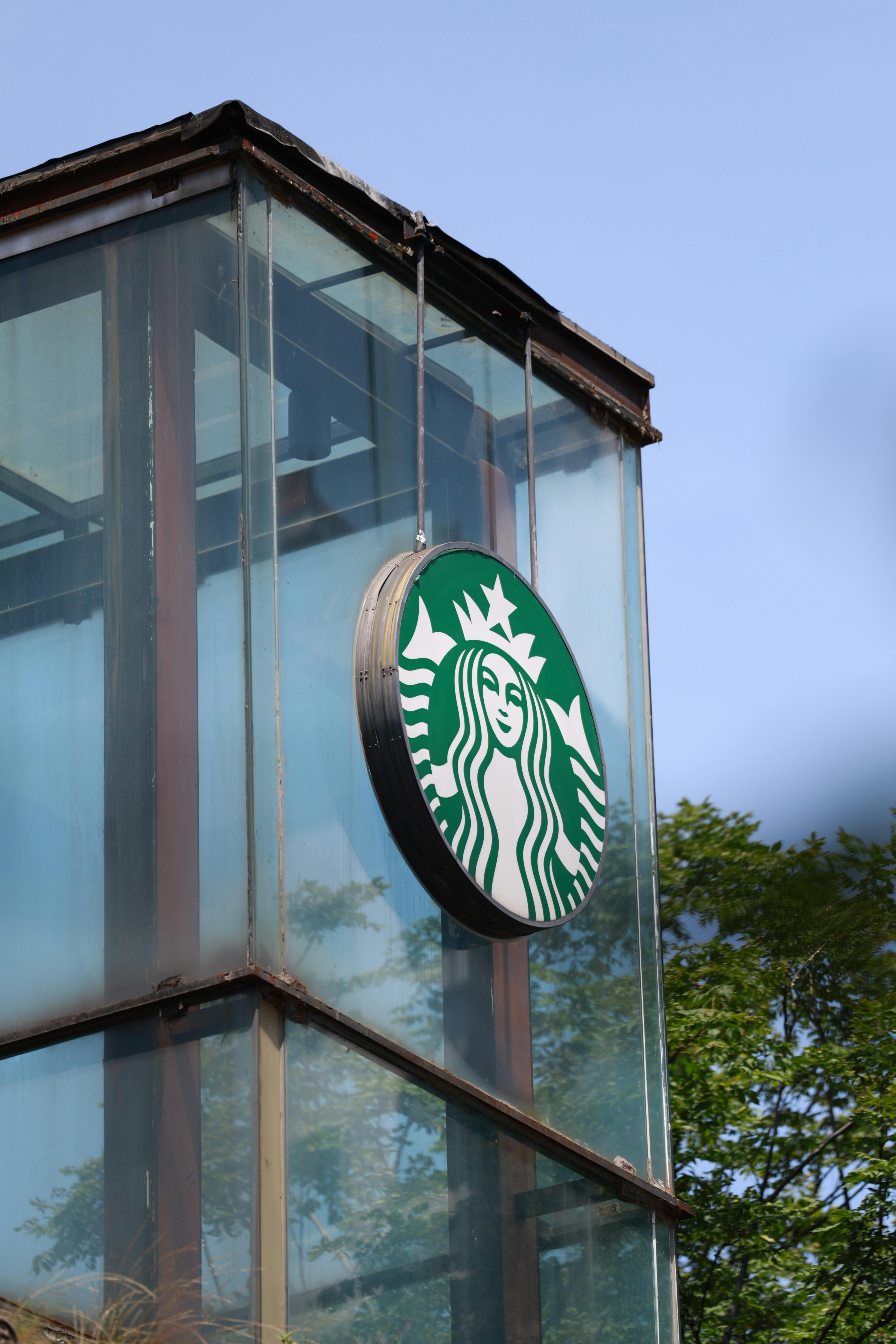 Starbucks Logo at the Exterior of a Building · Free Stock Photo