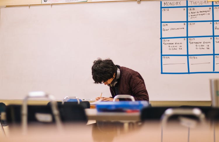 Man Writing On Table