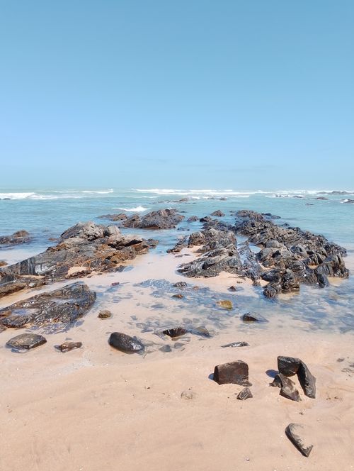 Free Beautiful rocky shoreline under clear skies in Casablanca, Morocco. Stock Photo