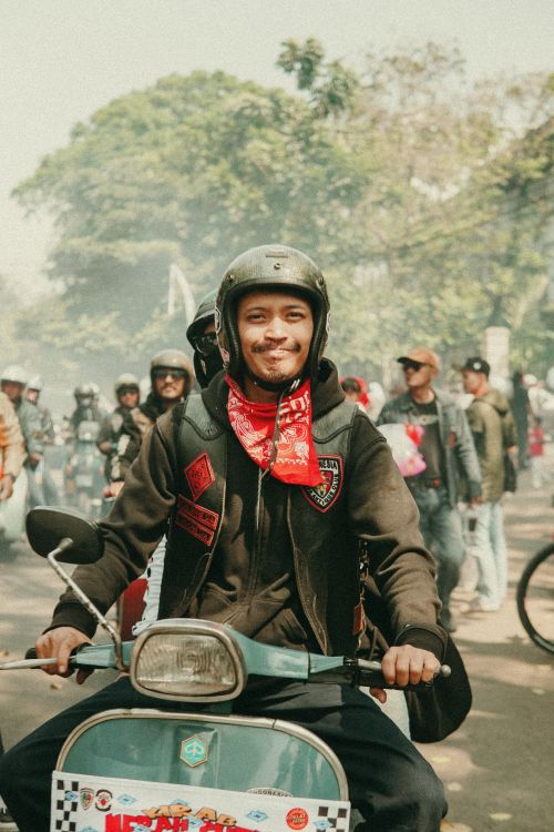 Free Vespa enthusiasts gathered in Bandung for a vibrant scooter parade. Stock Photo