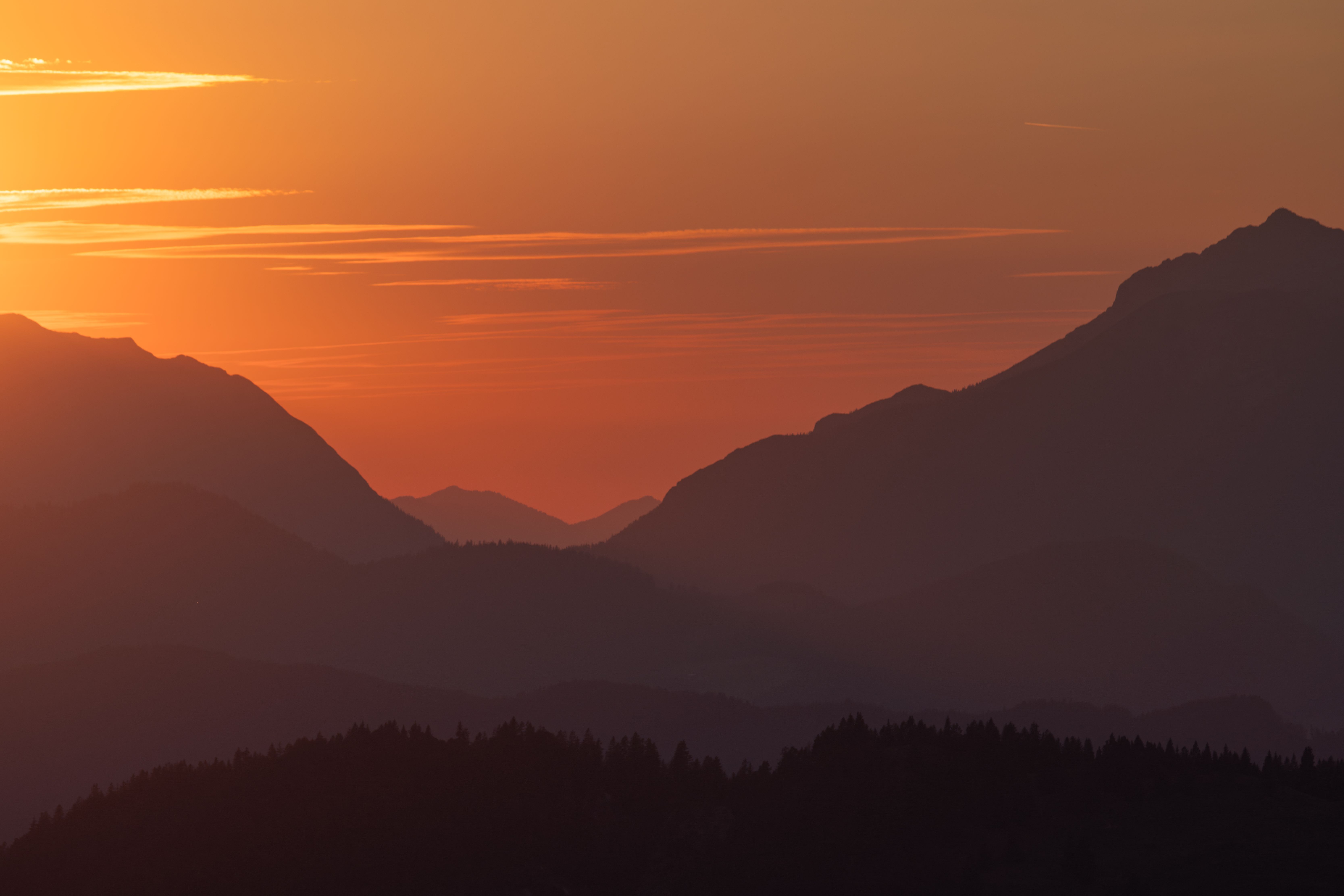 Stunning Sunset Over Majestic Mountain Range · Free Stock Photo