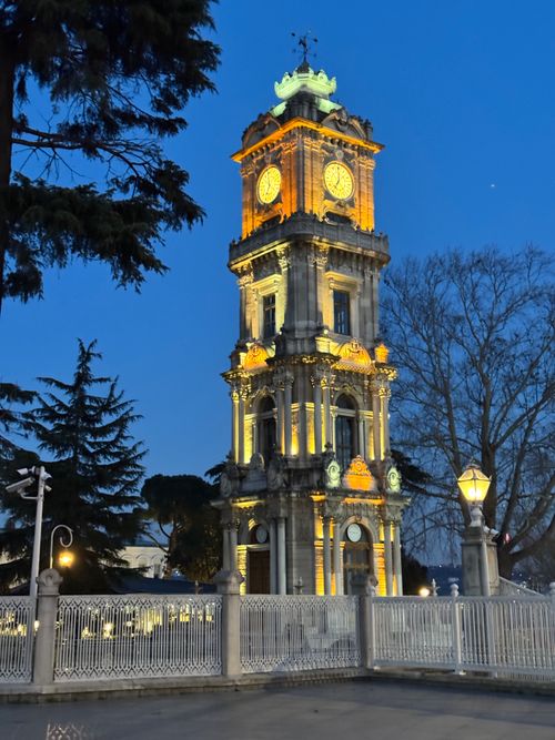 Free Stunning view of the illuminated Dolmabahçe Clock Tower in Istanbul during dusk, highlighting its architectural details. Stock Photo