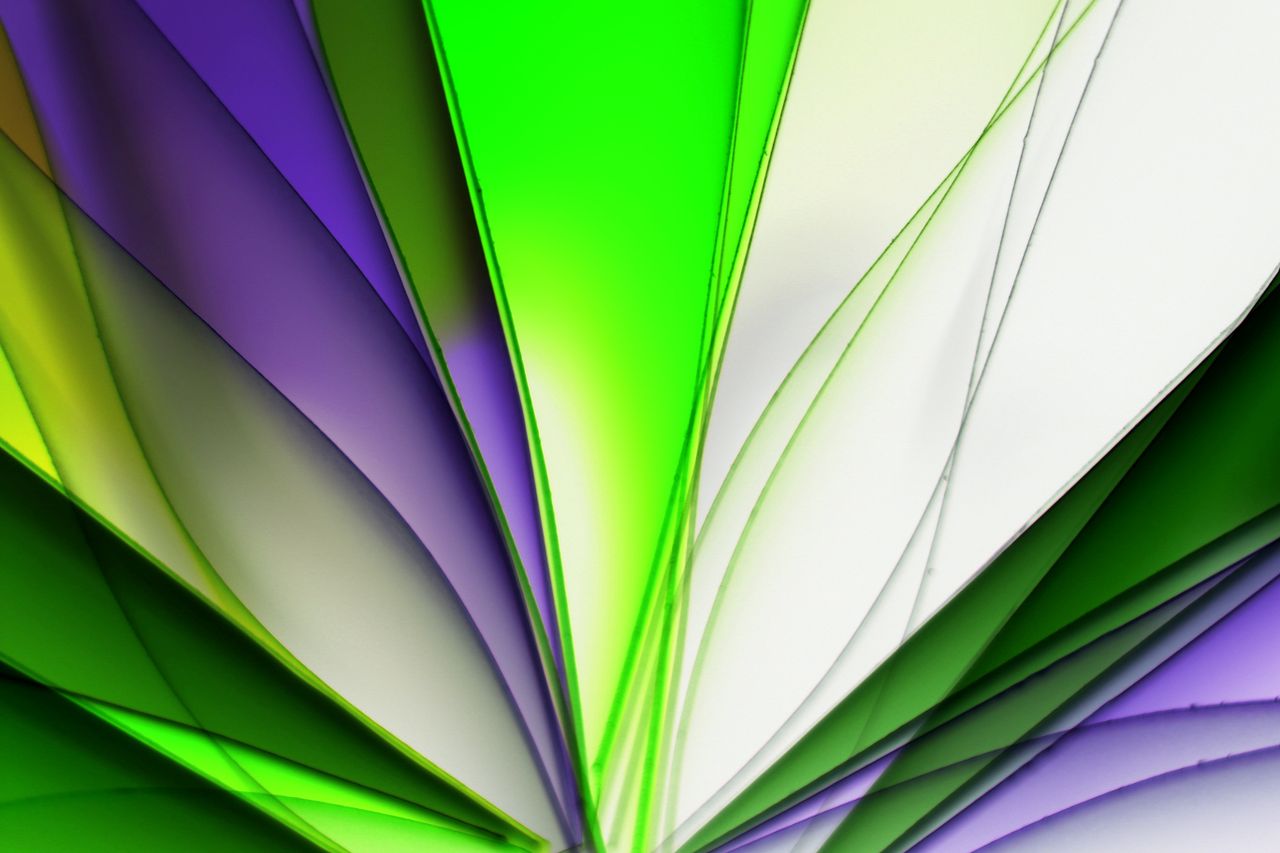 a vivid abstract design featuring layers of colorful folded paper in g