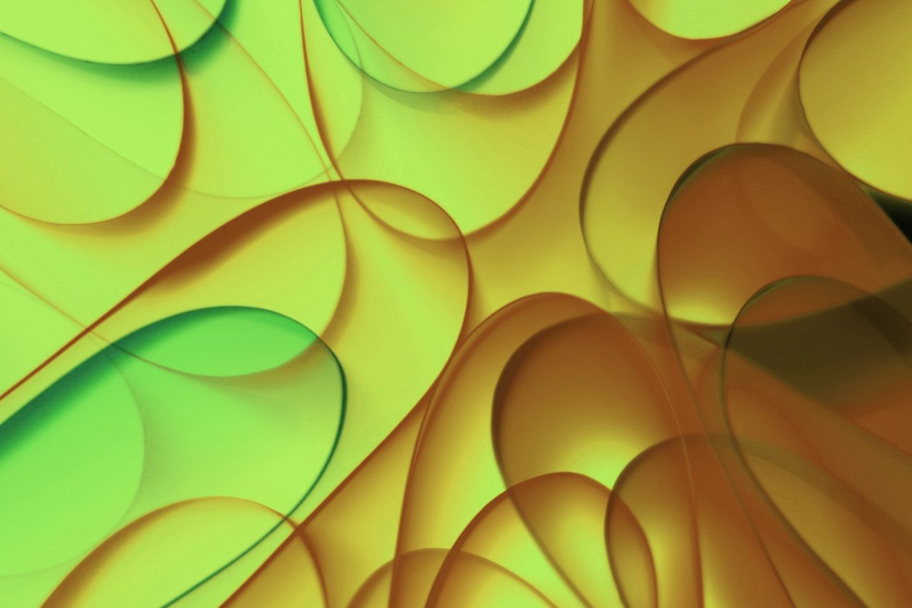 vibrant abstract image showcasing flowing green and yellow curves in a