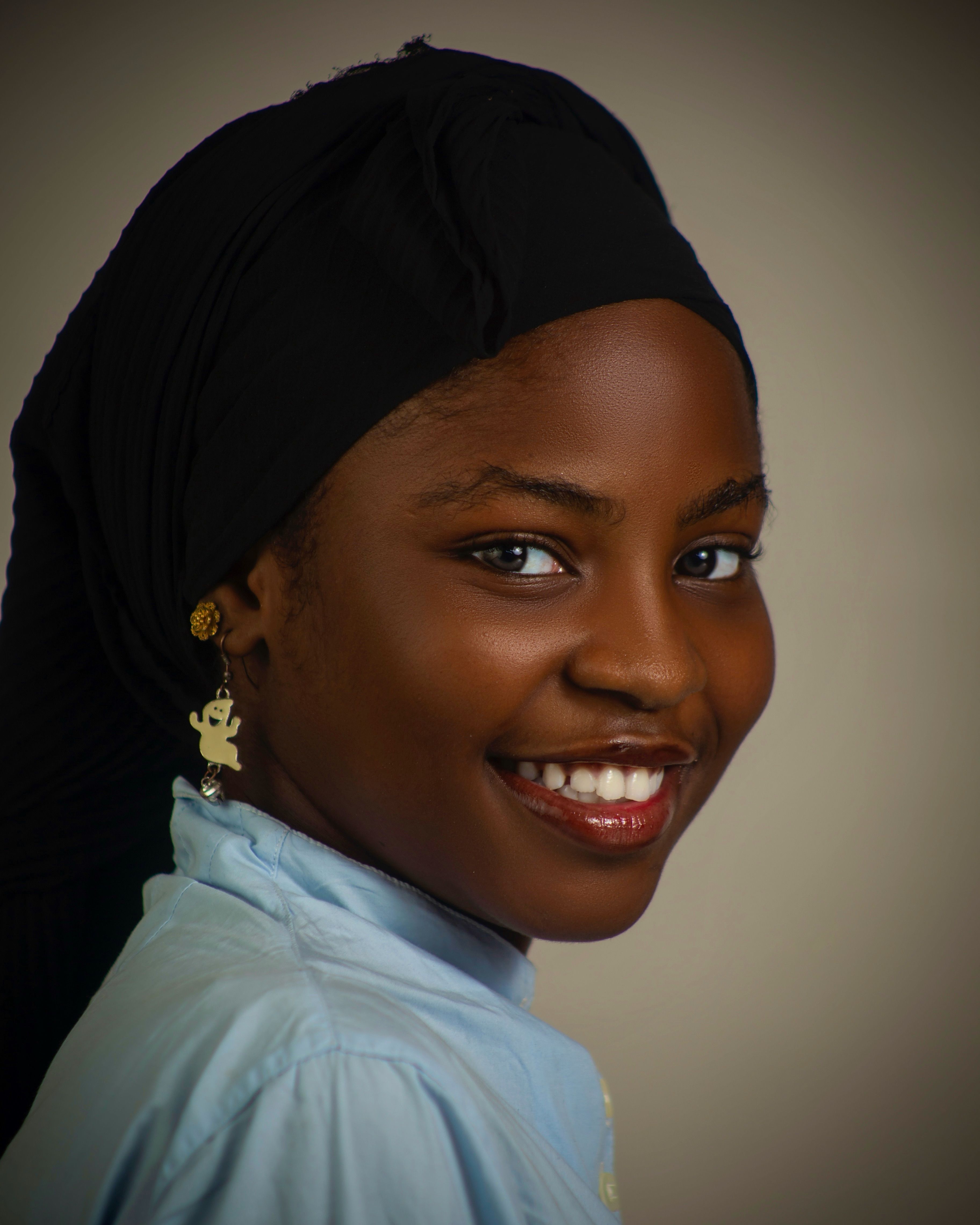 Portrait of Smiling Woman in Traditional Headscarf · Free Stock Photo