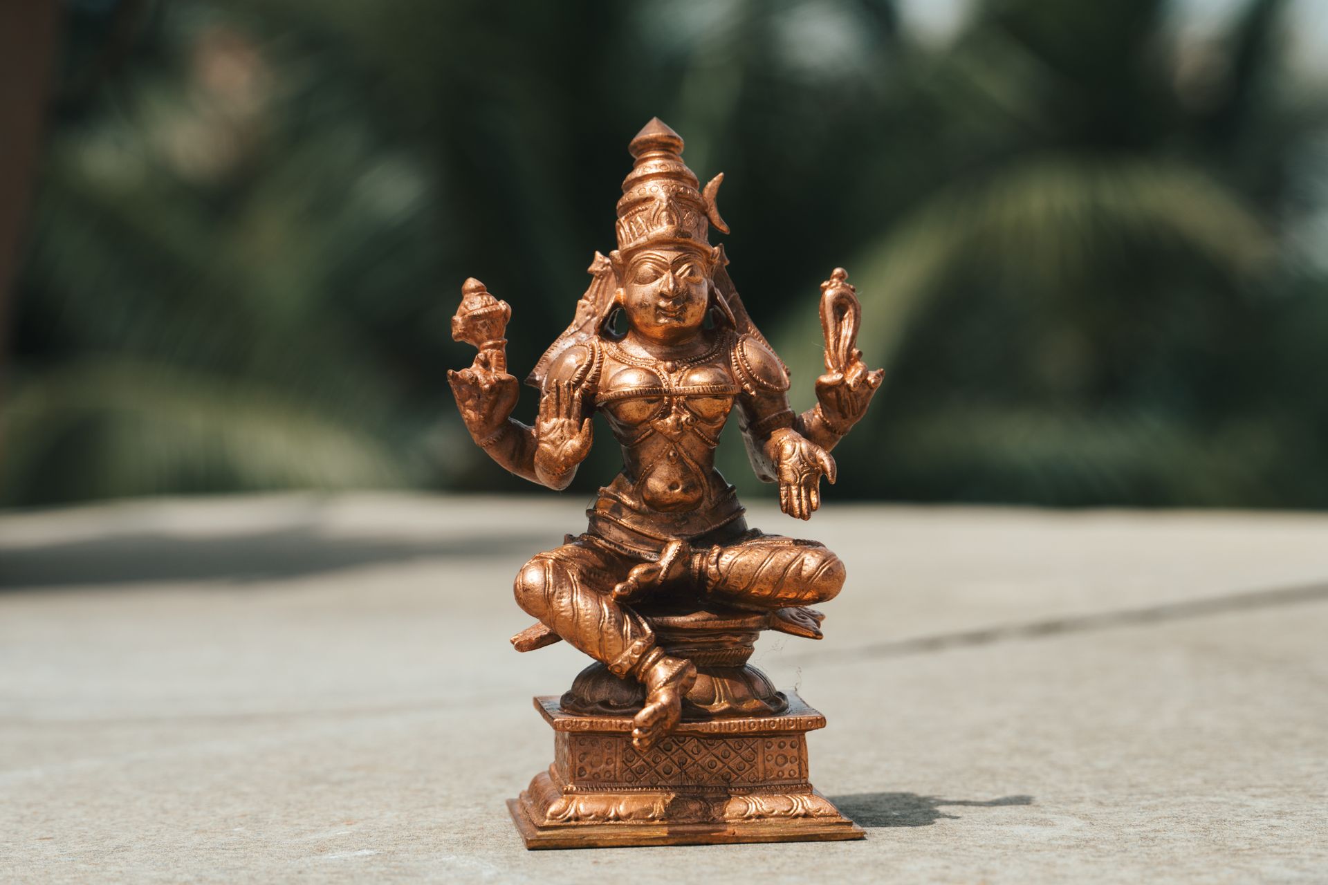 Hindu Deity Copper Statue in Close Up Photography