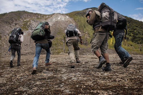 Five Men Running Near Mountain