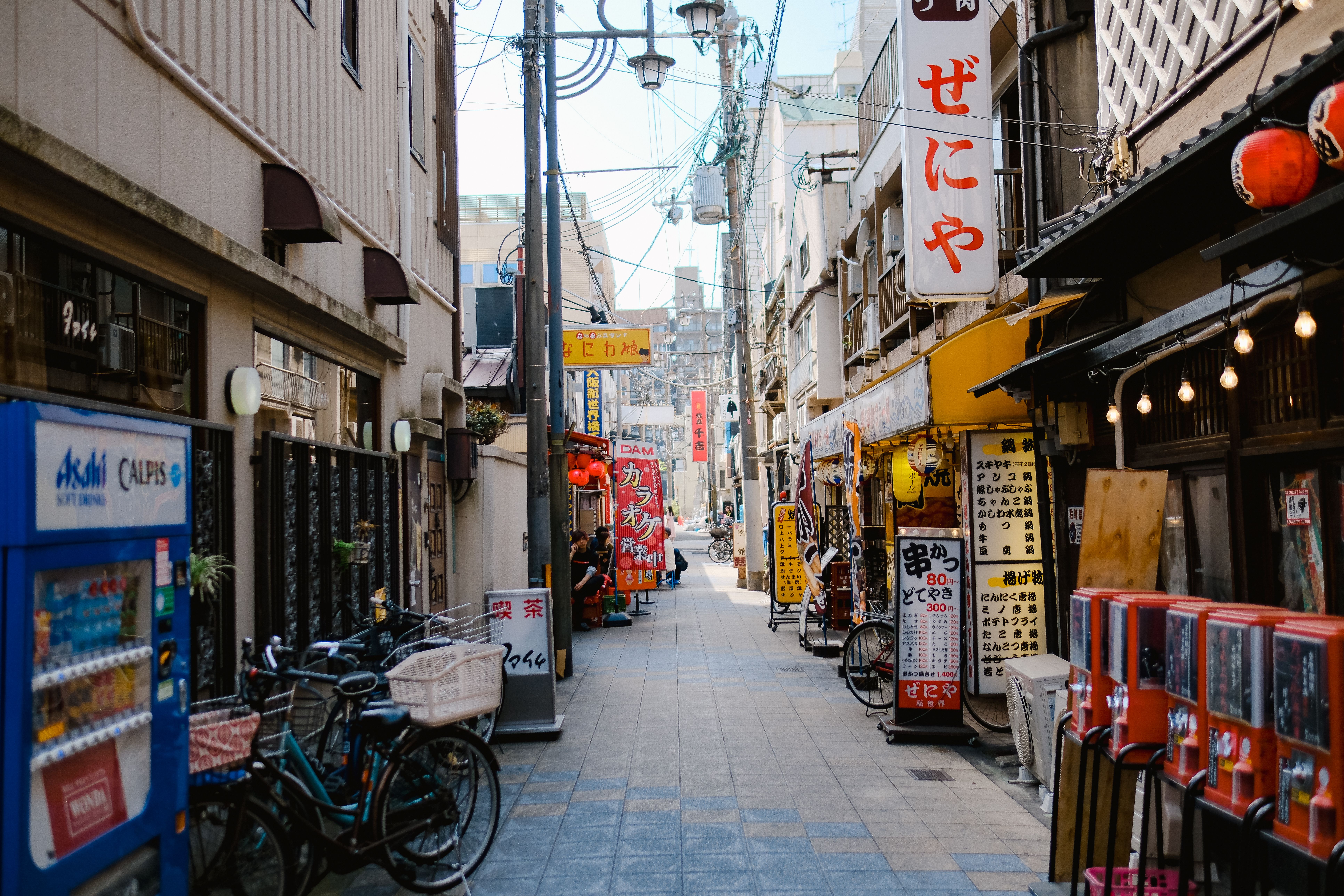 Quiet Osaka side street with bicycle and small shops
