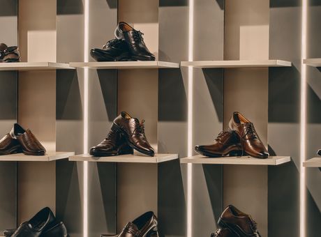 Men's footwear on display shelves