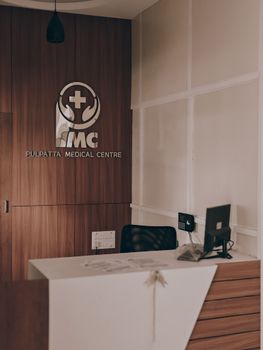 Warm and inviting medical center reception showcasing contemporary design with wood panel accents.