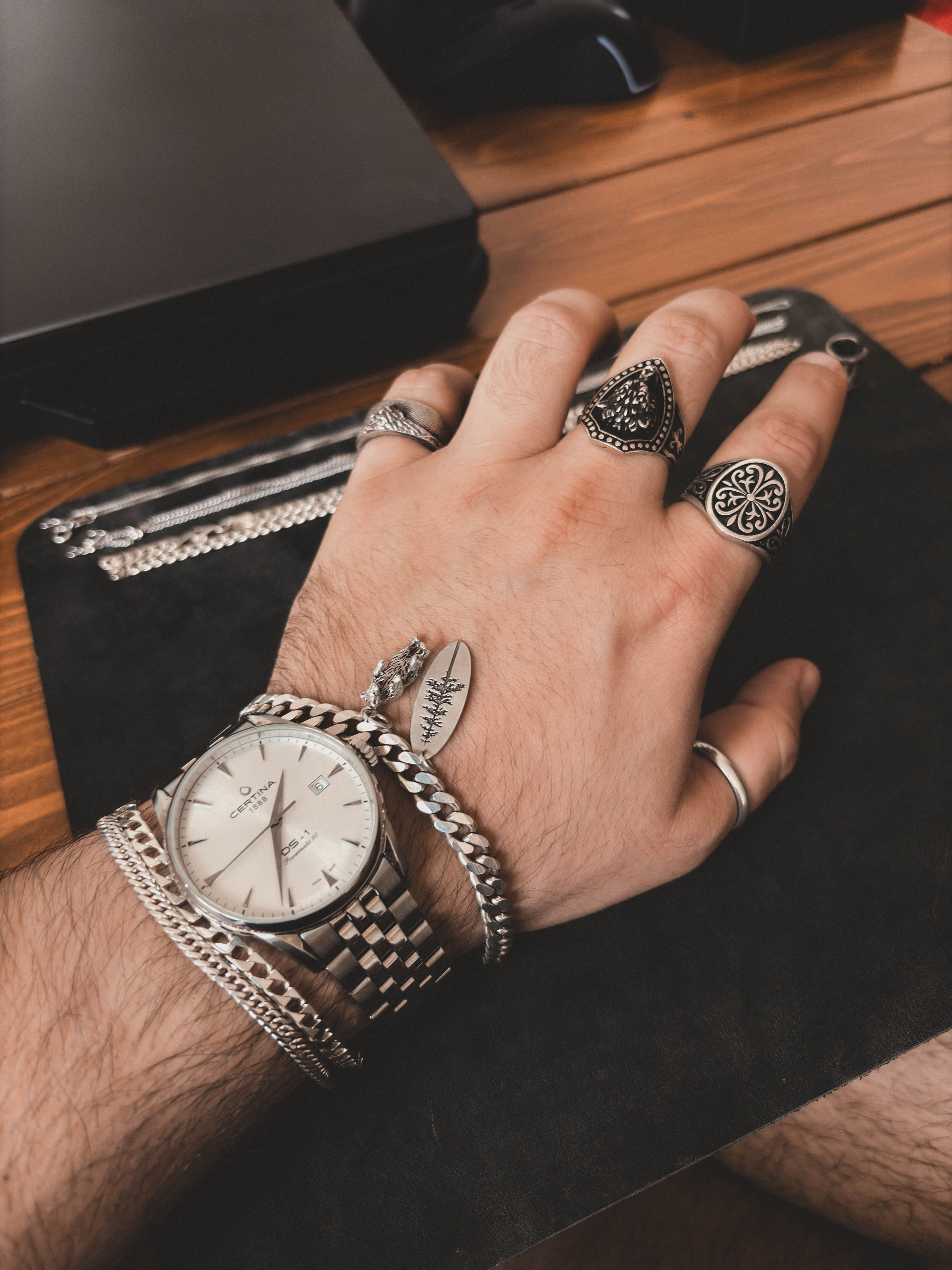 Stylish Man's Hand with Watches and Rings · Free Stock Photo