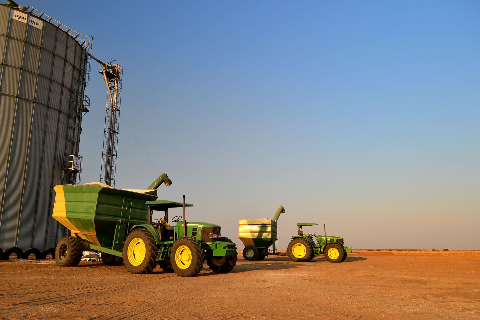 South African farm with tractors and grain silos