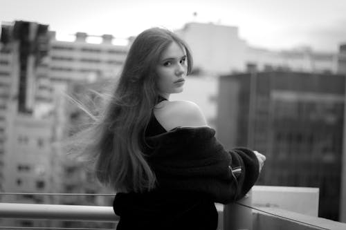 Moody black and white portrait of a woman on a rooftop in Mexico City.