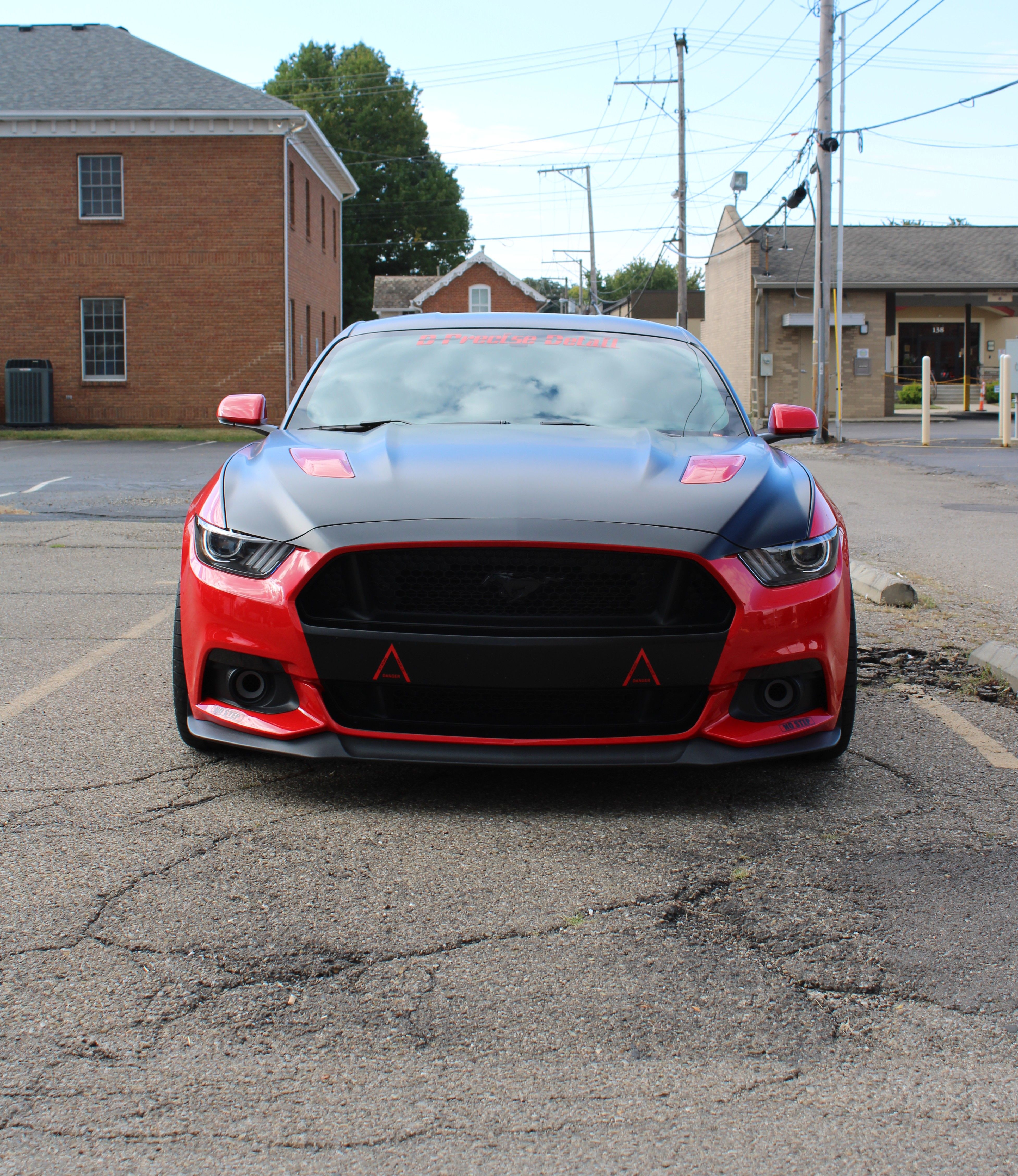 front-view-of-a-red-and-black-ford-mustang-in-lancaster-free-stock-photo