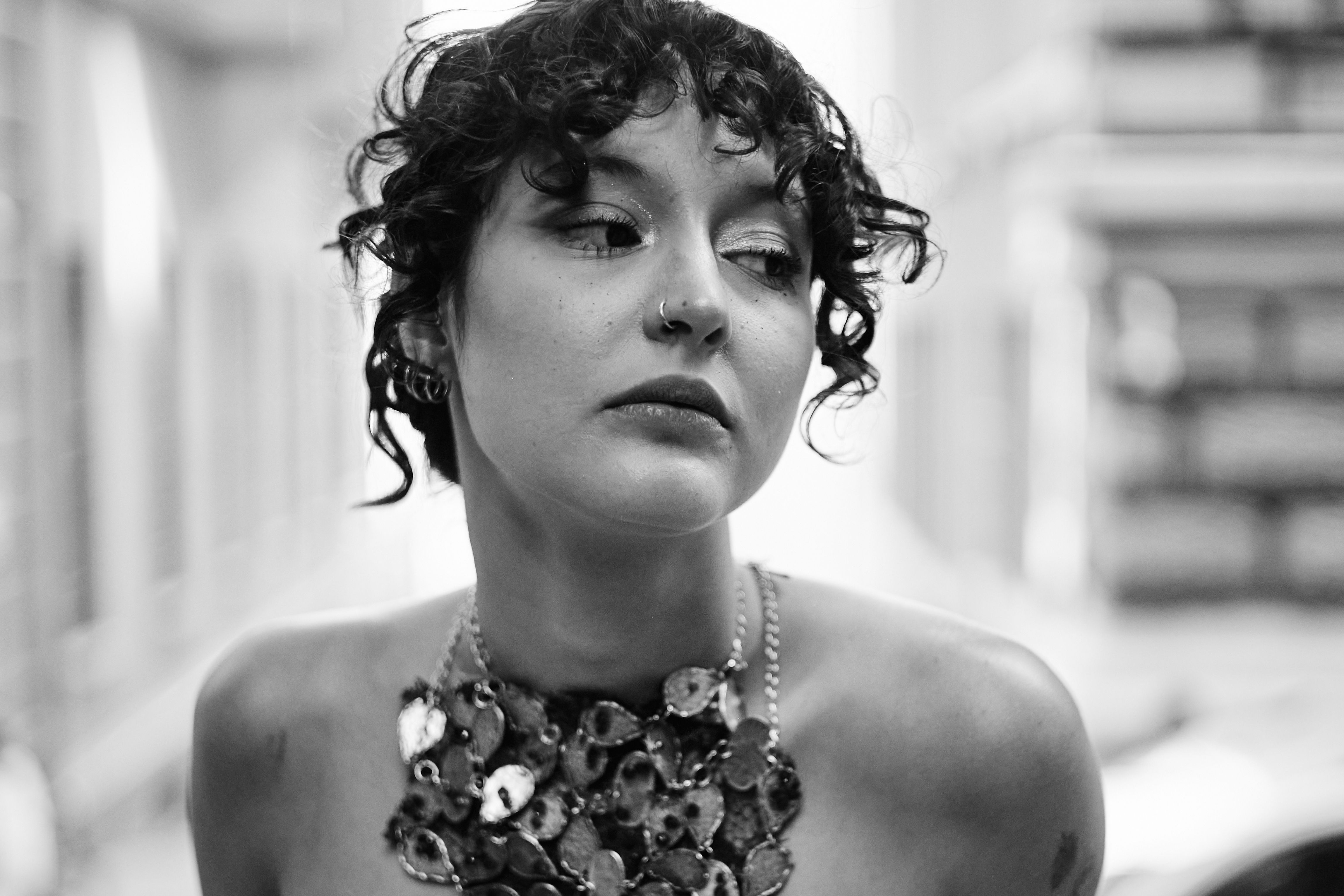 Portrait of Stylish Woman with Curly Hair in Istanbul · Free Stock Photo
