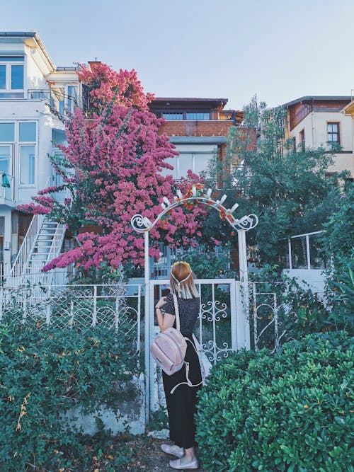 Woman in Front of Gate