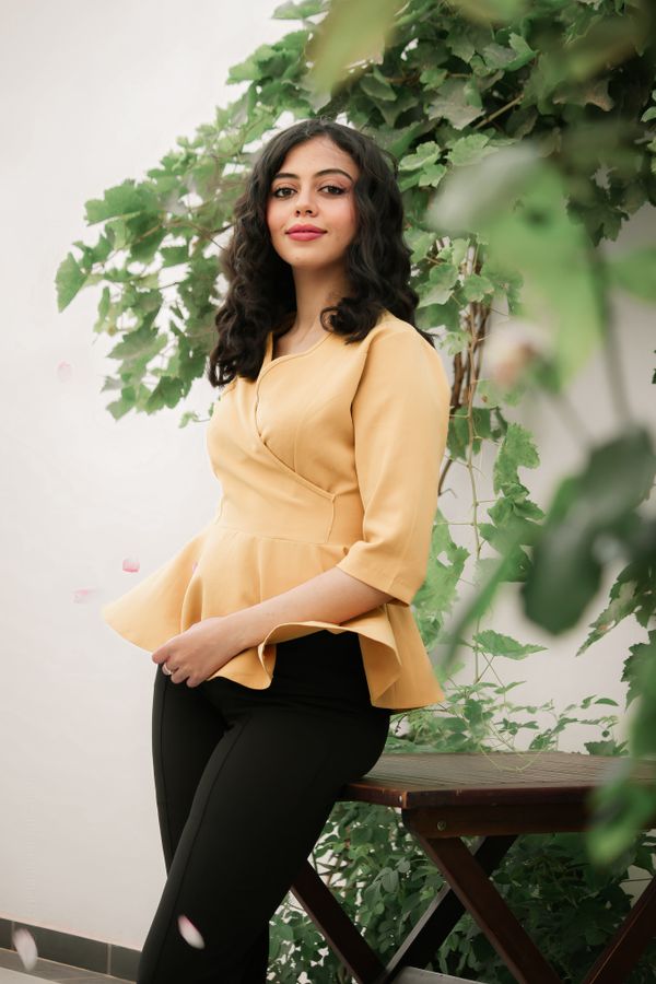 Peplum blouse with tailored trousers