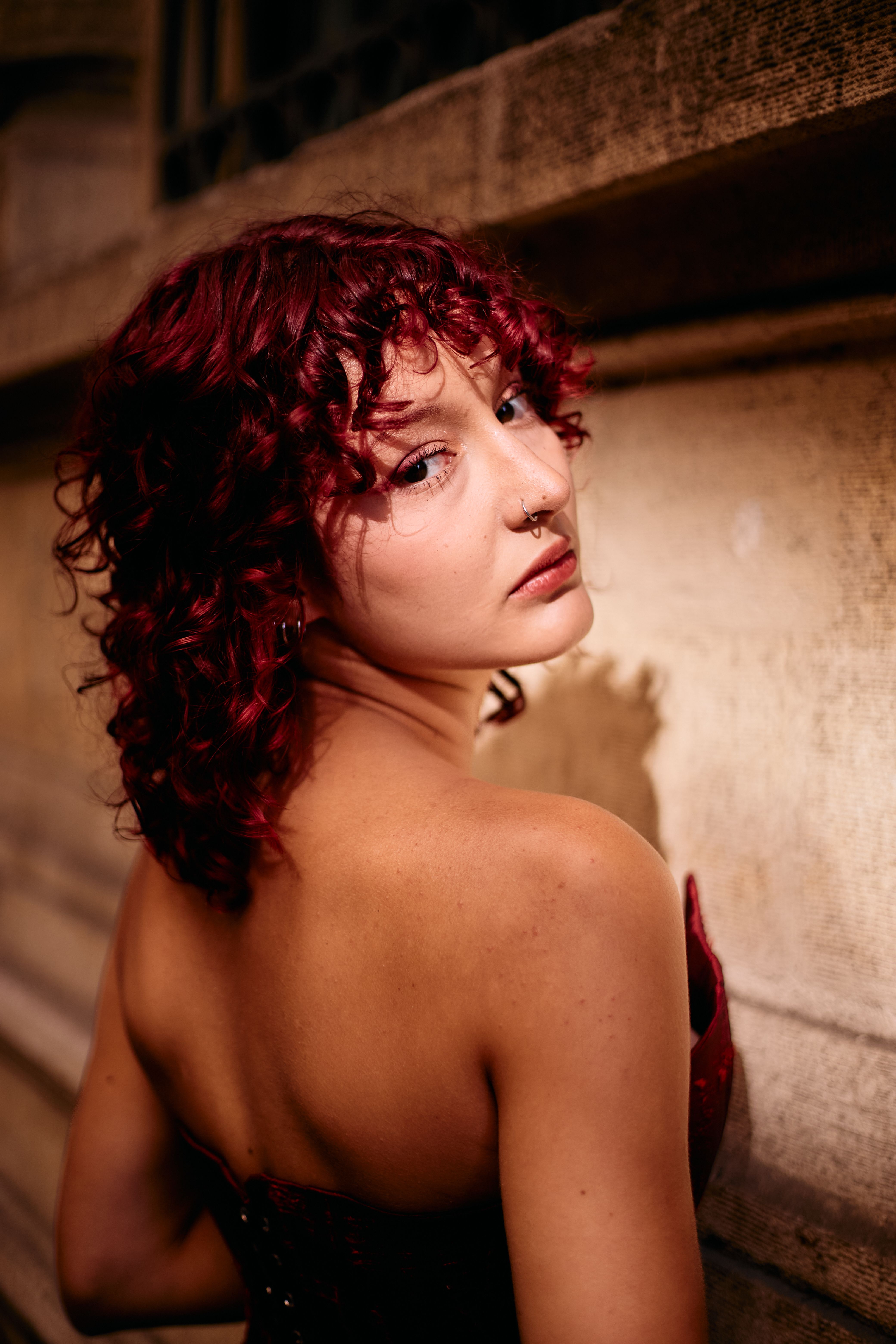 Elegant Portrait of Woman with Red Curly Hair · Free Stock Photo