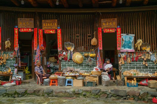 Authentic market scene in Xiamen, China, featuring local crafts and goods displayed at outdoor stalls.