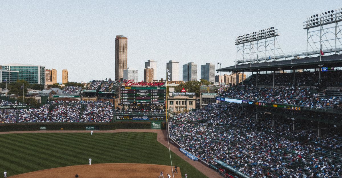 Fans reacting to a pitch clock violation at a baseball game, stadium atmosphere