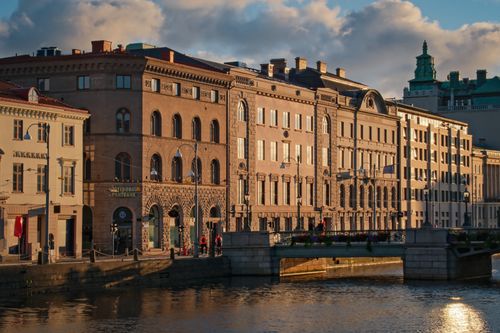 Free Sunlit view of historical architecture and bridge over water in Gothenburg, Sweden. Stock Photo