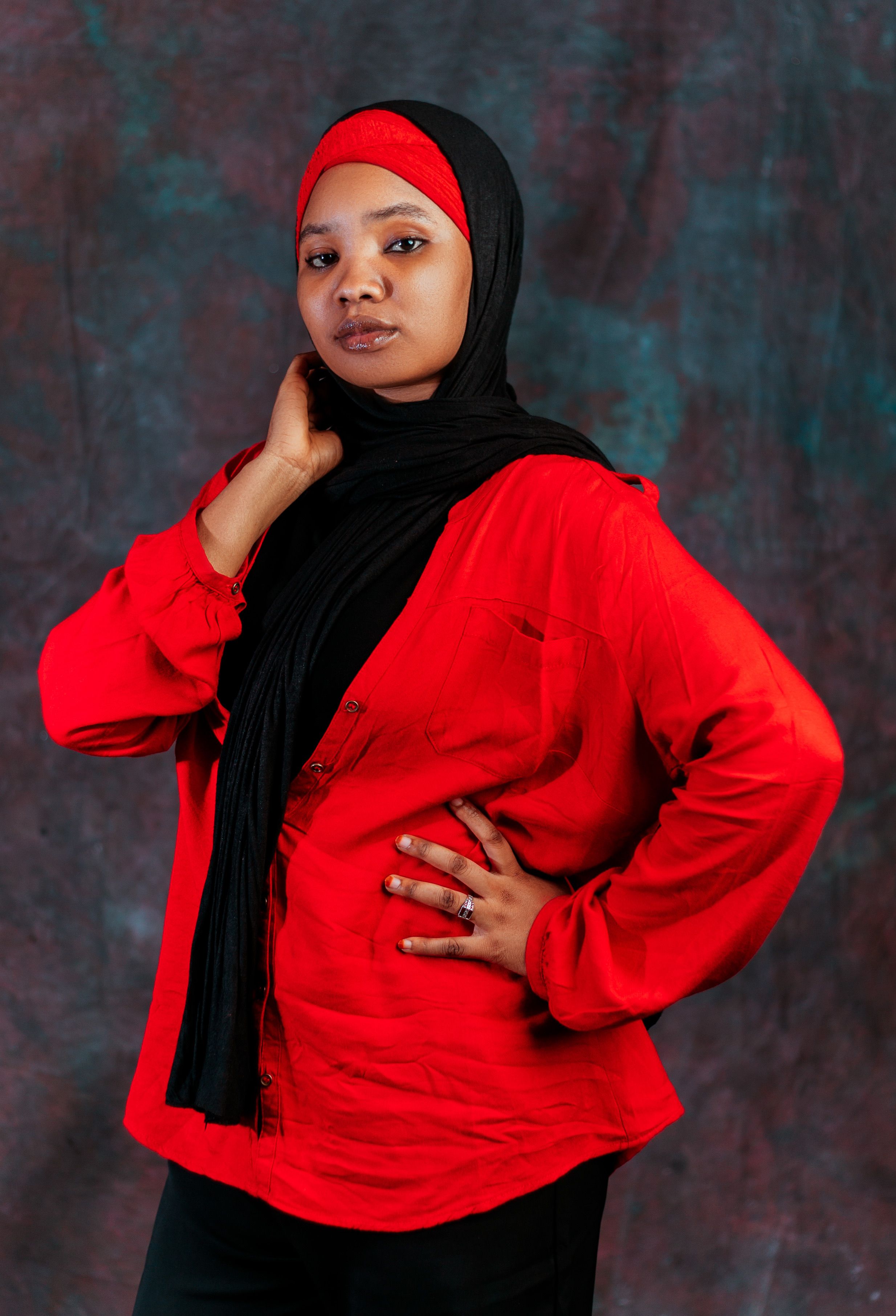 Confident Woman in Red Top and Black Hijab Portrait · Free Stock Photo