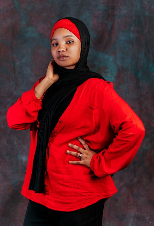 Confident Woman in Red Top and Black Hijab Portrait · Free Stock Photo